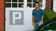 Photo of Anthony Eskinazi standing in front of a garage